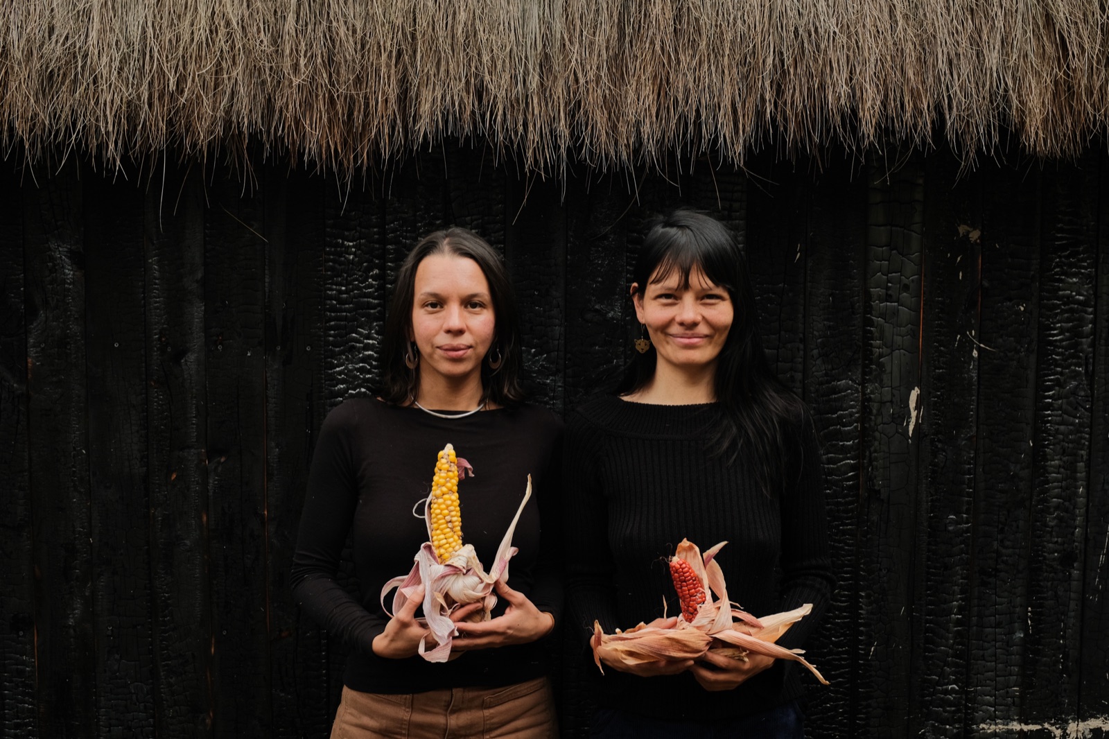 Elemental Birth School founders Amapola Pacheco and Aya Maria Maldonado holding heirloom corn